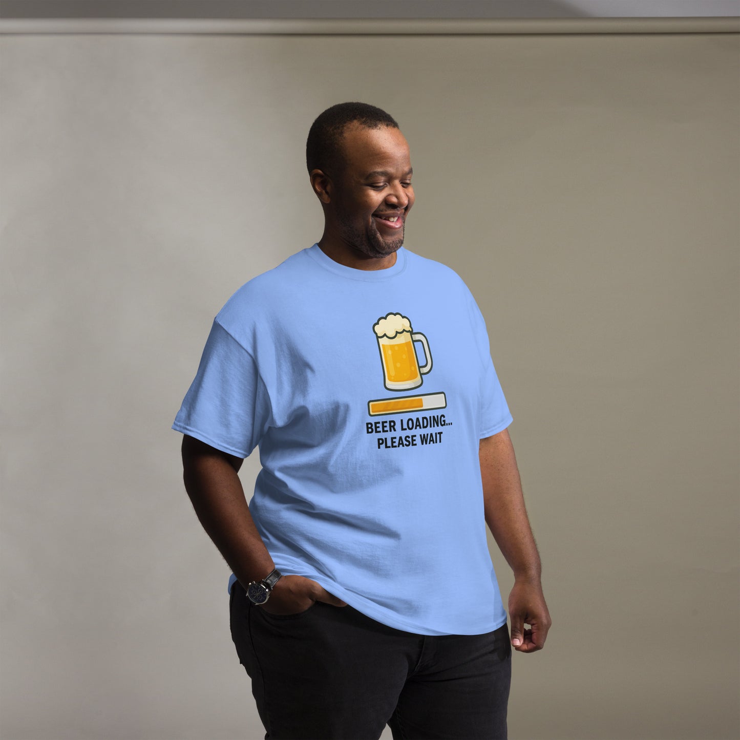 Graphic t-shirt with beer mugs clinking and International Beer Day text, flat lay