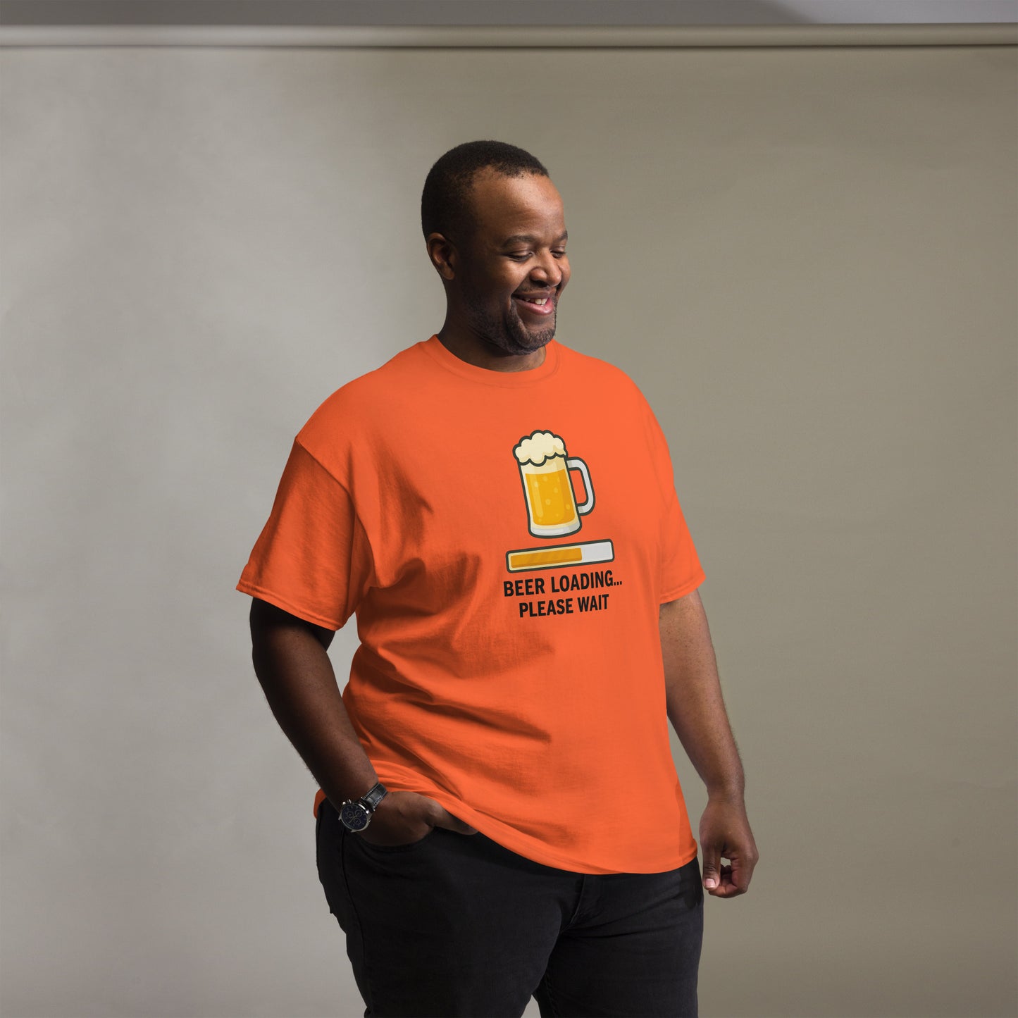 Graphic t-shirt with beer mugs clinking and International Beer Day text, flat lay