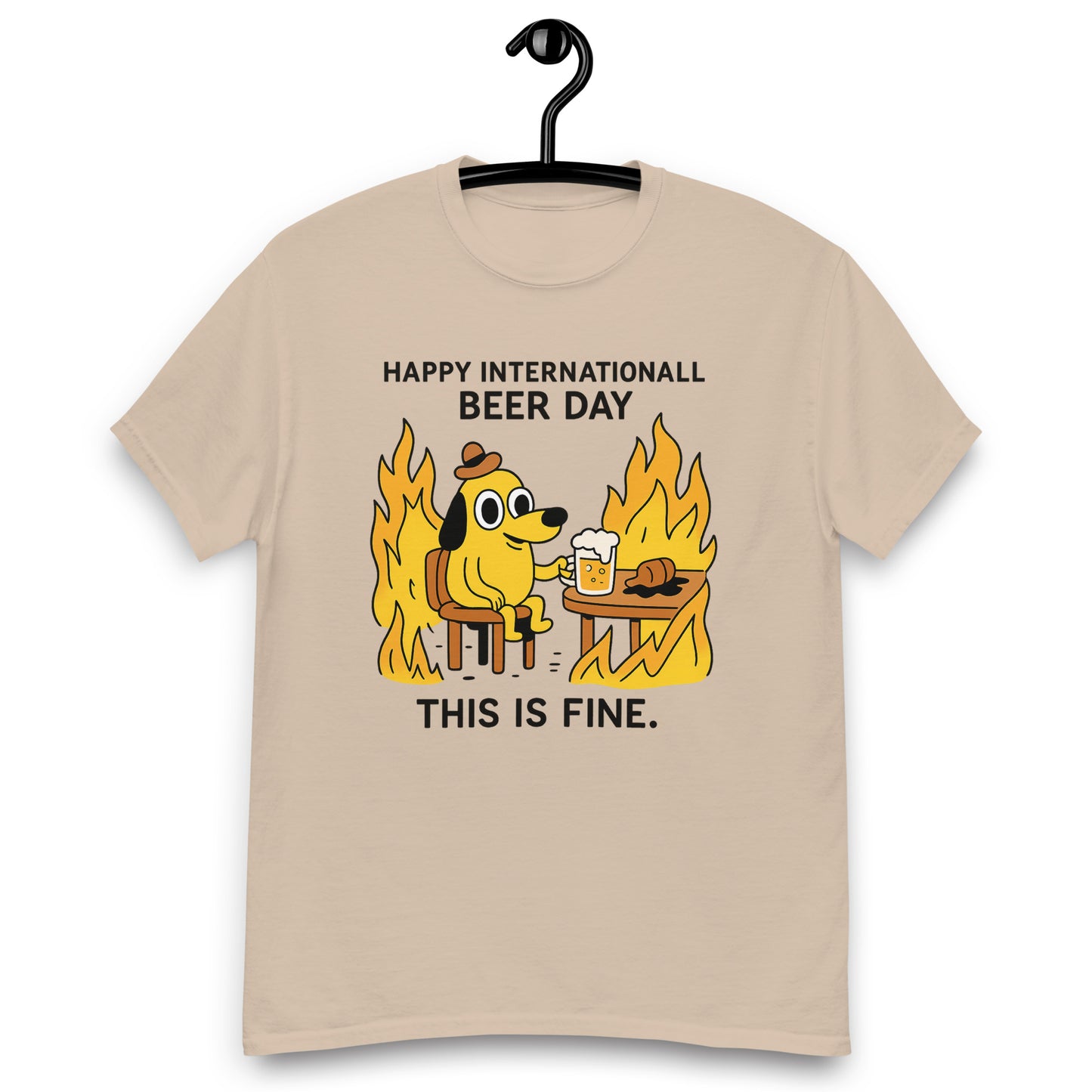 Graphic t-shirt with beer mugs clinking and International Beer Day text, flat lay