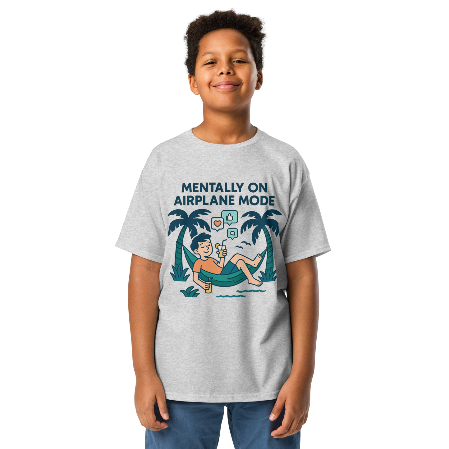 School’s Out t-shirt with bold colorful lettering, flat lay on wooden surface