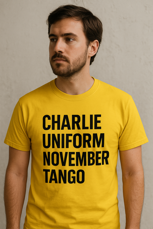 Man wearing a yellow t-shirt with 'CHARLIE UNIFORM NOVEMBER TANGO' text.