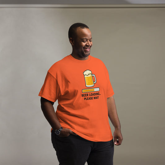 Graphic t-shirt with beer mugs clinking and International Beer Day text, flat lay