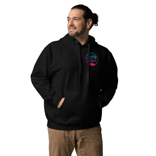 Streamer JustiinTV wearing branded hoodie at gaming setup with RGB lighting