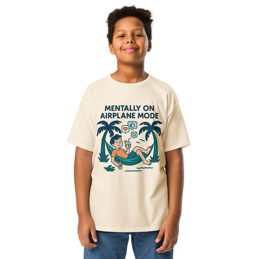 School’s Out t-shirt with bold colorful lettering, flat lay on wooden surface